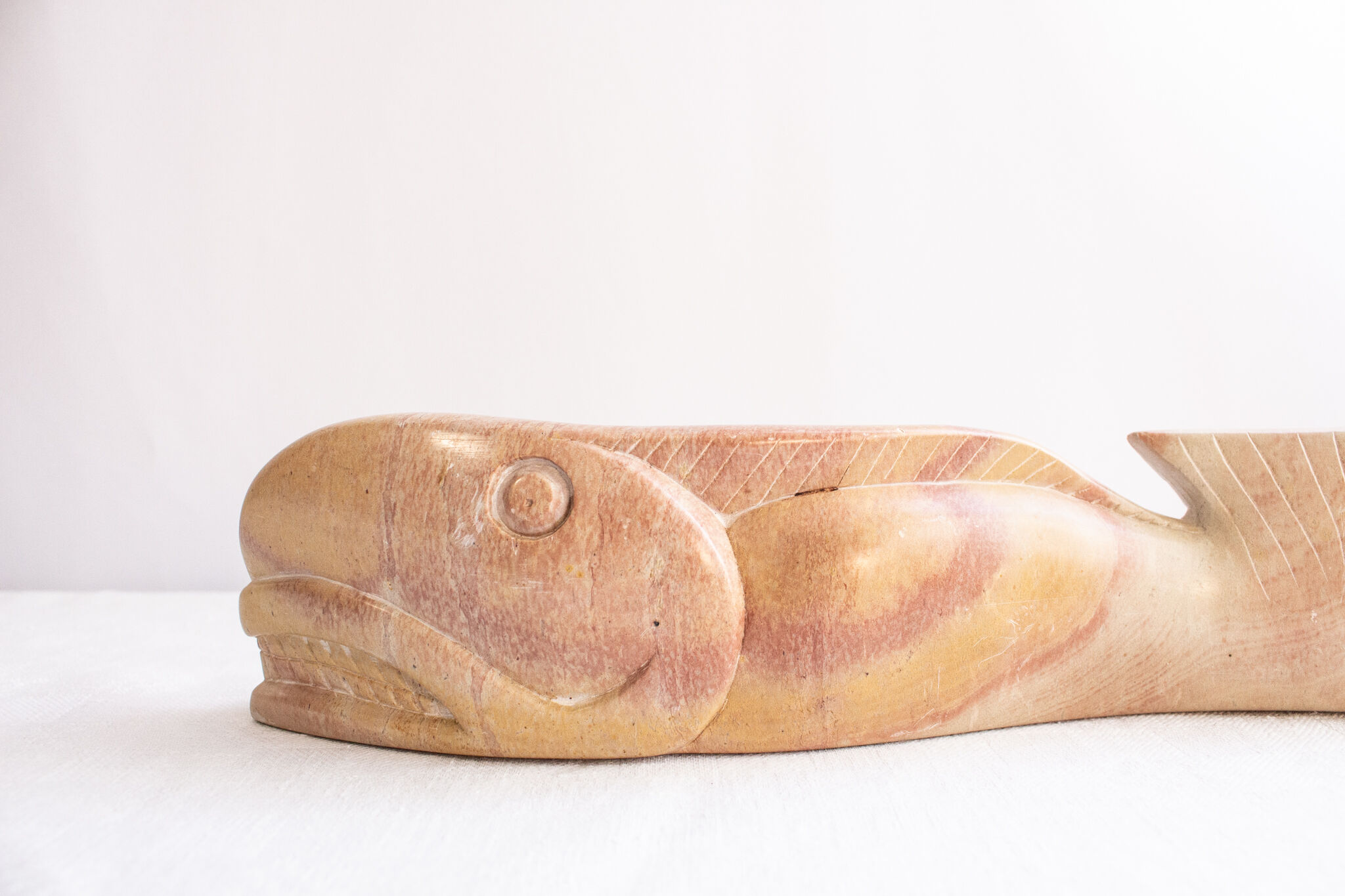 Inuit marble statuette. Primitive whale statue. Artifact from North America.