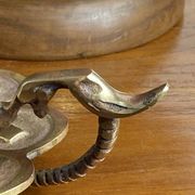 Handheld candlestick in bronze, card game decoration