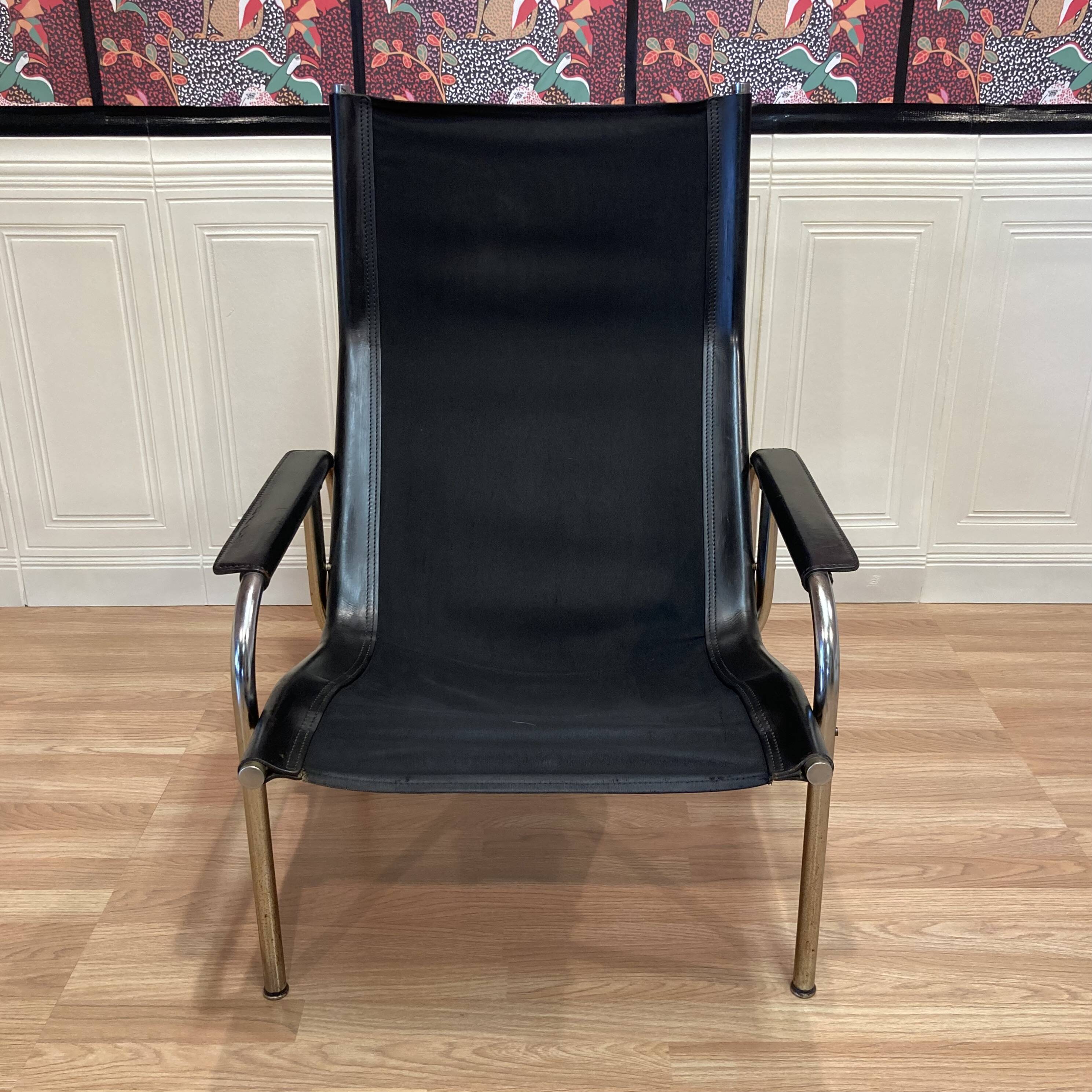 Reclining armchair in black leather and chrome design "hans eichenberger" 1960.