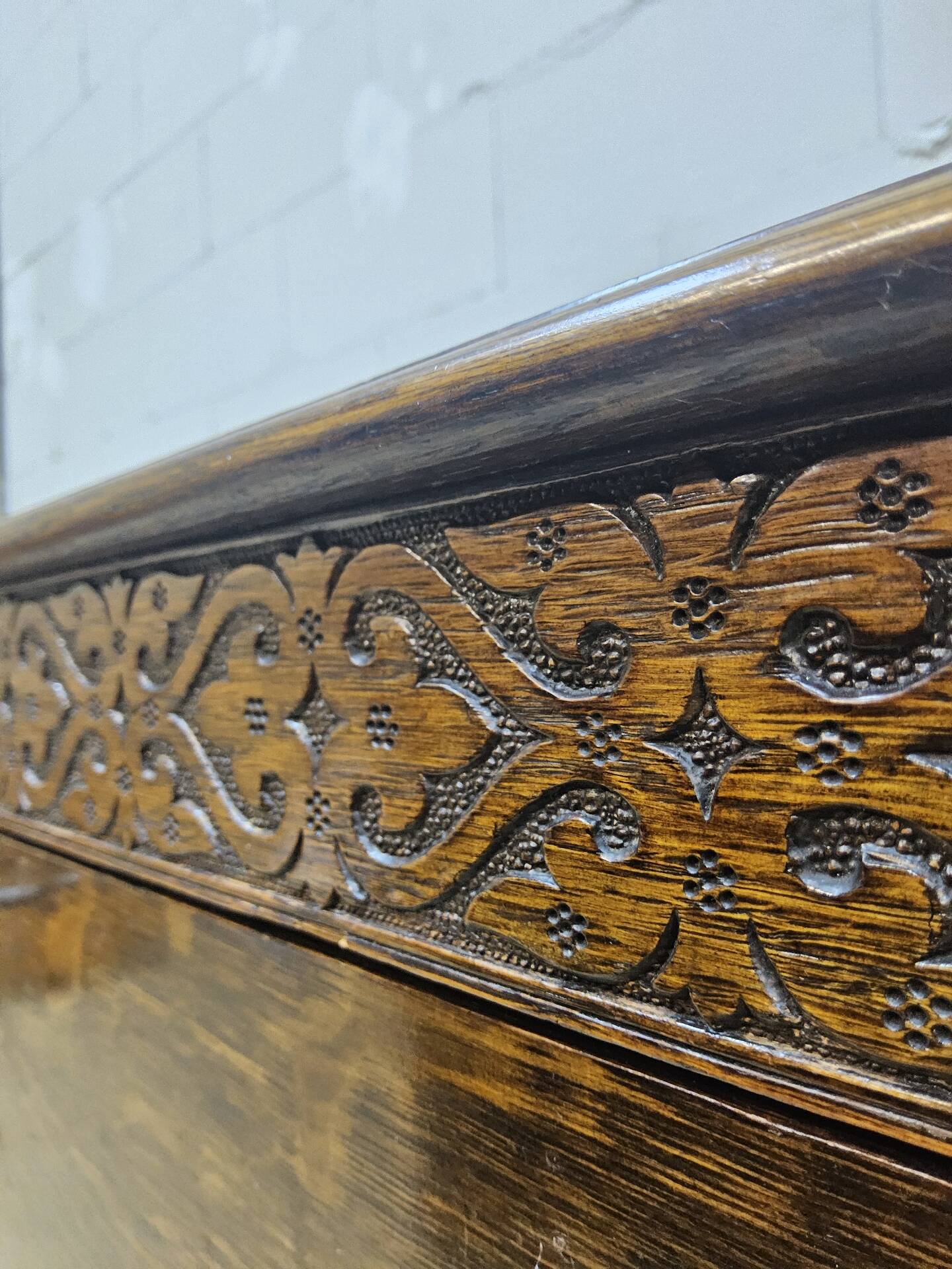 Antique chest of drawers on wheels with wood carving (key top drawer)
