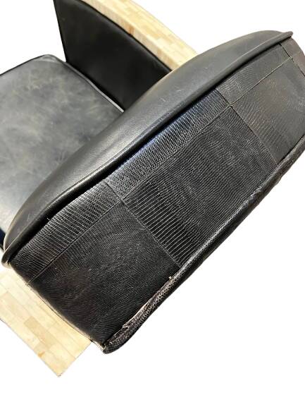 Pair of leather armchairs with marquetry armrests