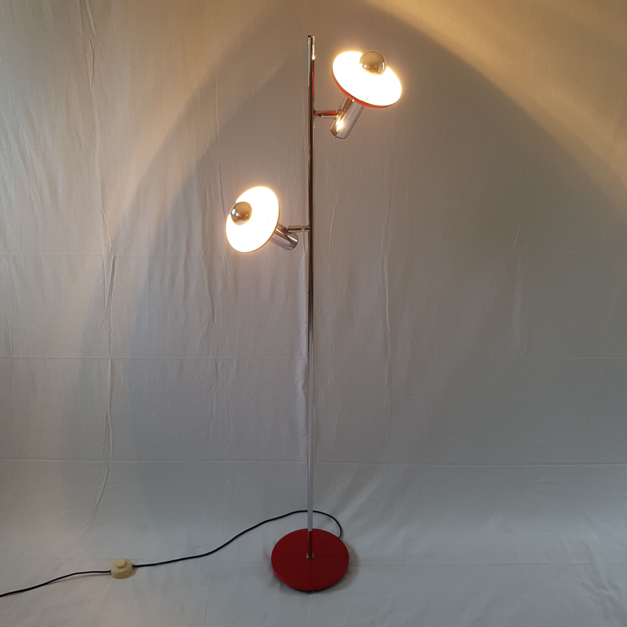 Two red lights and chrome floor lamp