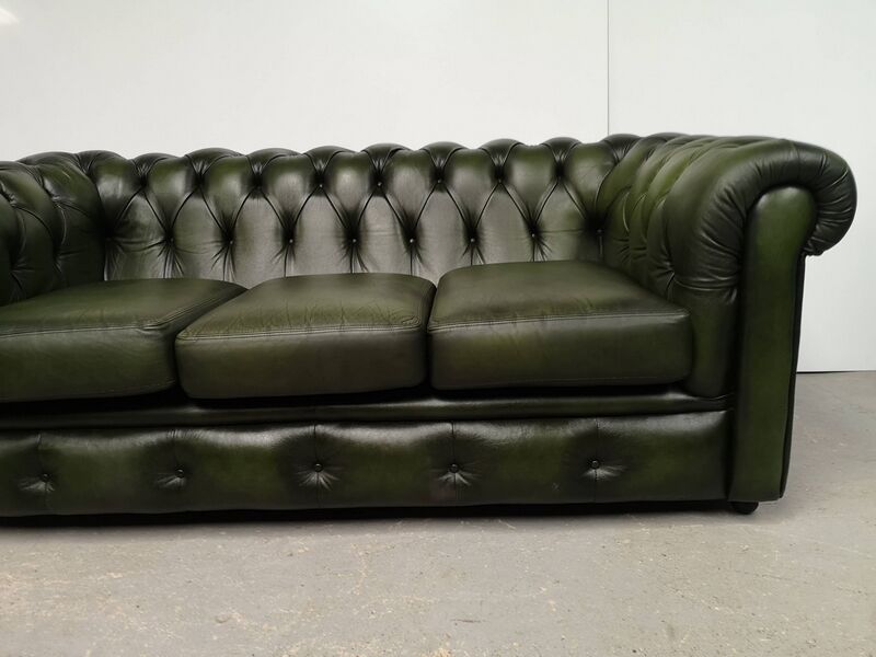 Three-seater green leather Chesterfield sofa