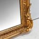 Miroir baroque doré avec guirlande de fleurs