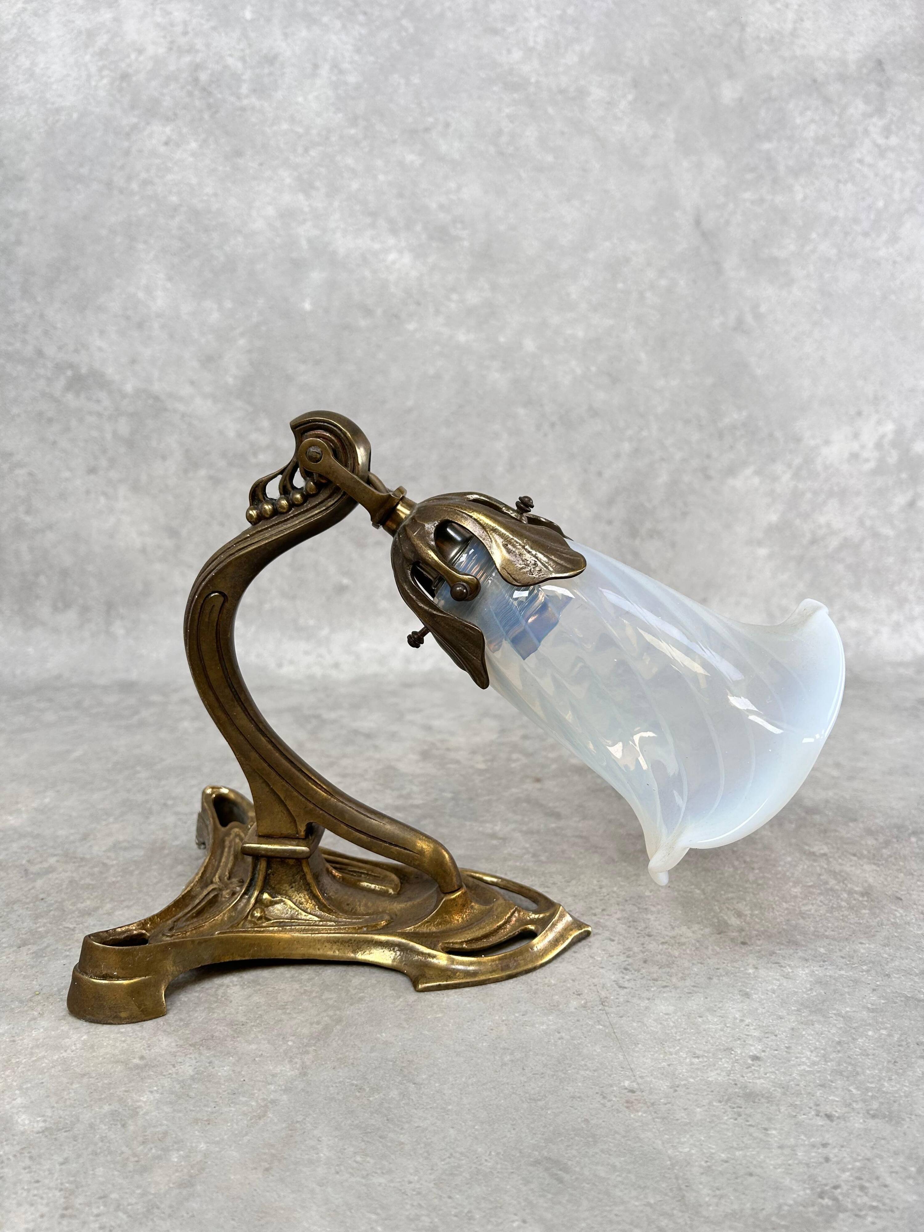 Art Nouveau wall sconces with opalescent iridescent glass