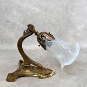Art Nouveau wall sconces with opalescent iridescent glass