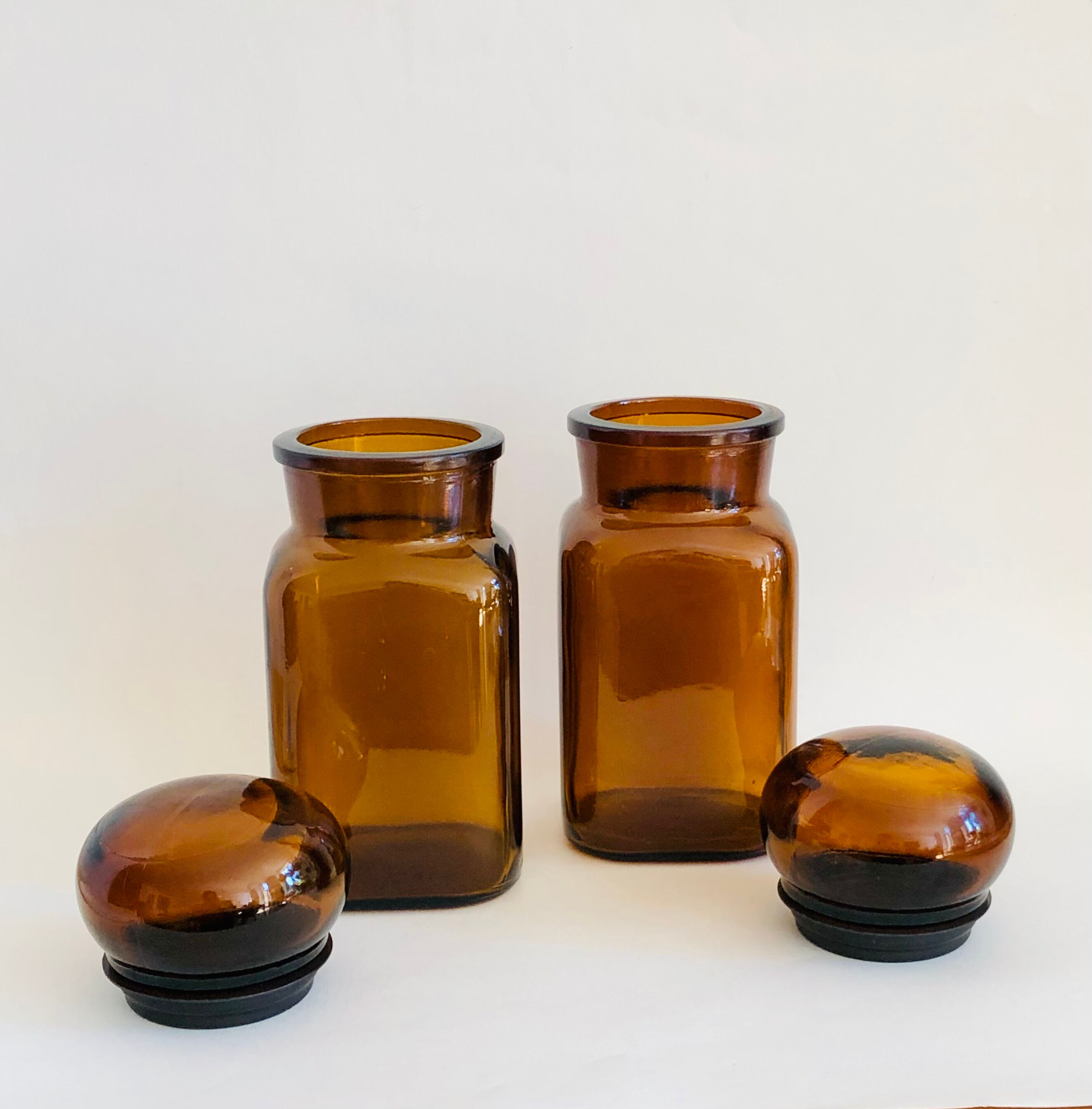 Pair of vintage amber glass jars
