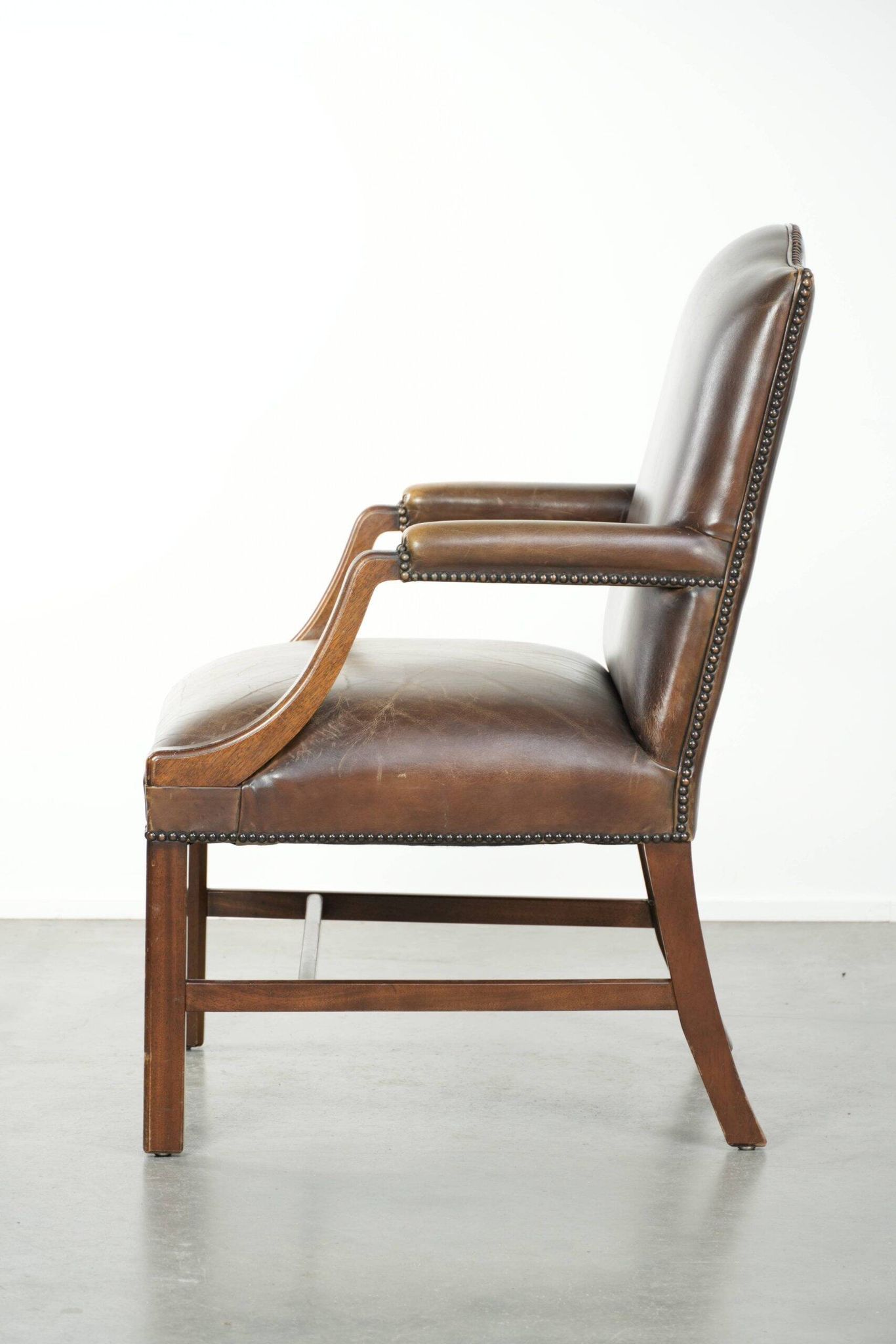 Wooden cow leather English Gainsborough chair with a stunning appearance