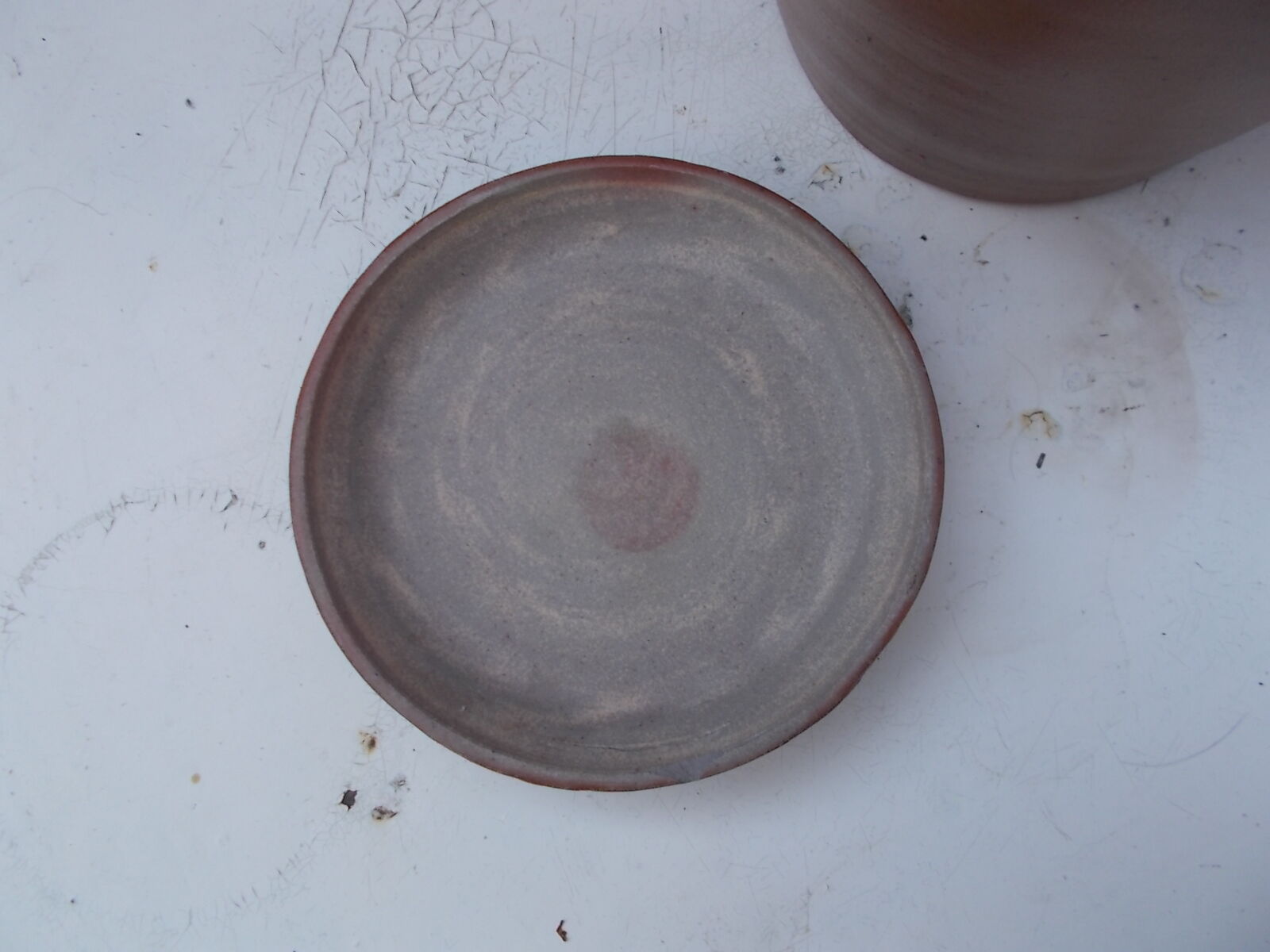 Old sandstone pot and its lid