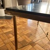 Black marble coffee table with brass legs.