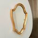 Vintage baroque mirror in gilded wood in the Louis XV style.