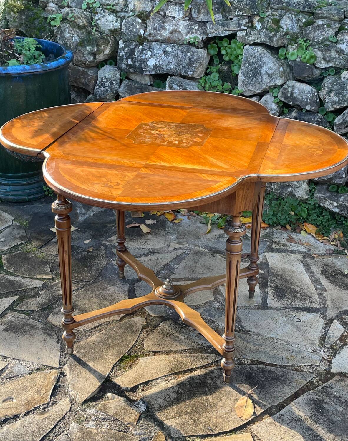 Center table decorated with marquetry of leaves and flowers in Louis XVI style, 19th century period
