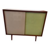 Small vintage piece of furniture with colorful glass doors