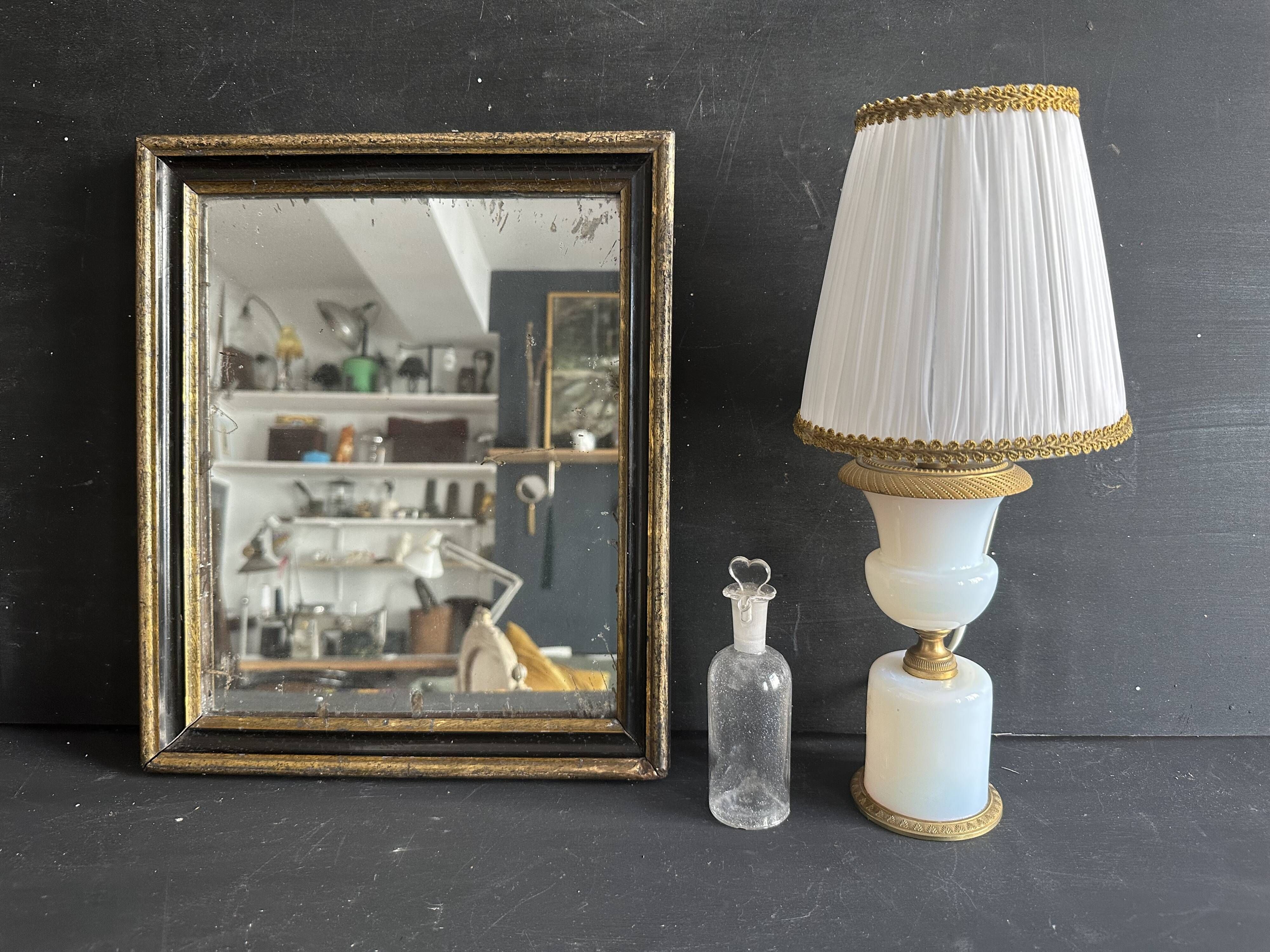 Miroir Napoléon III en bois noir et doré, XIXe siècle