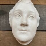 Plaster face wall statue