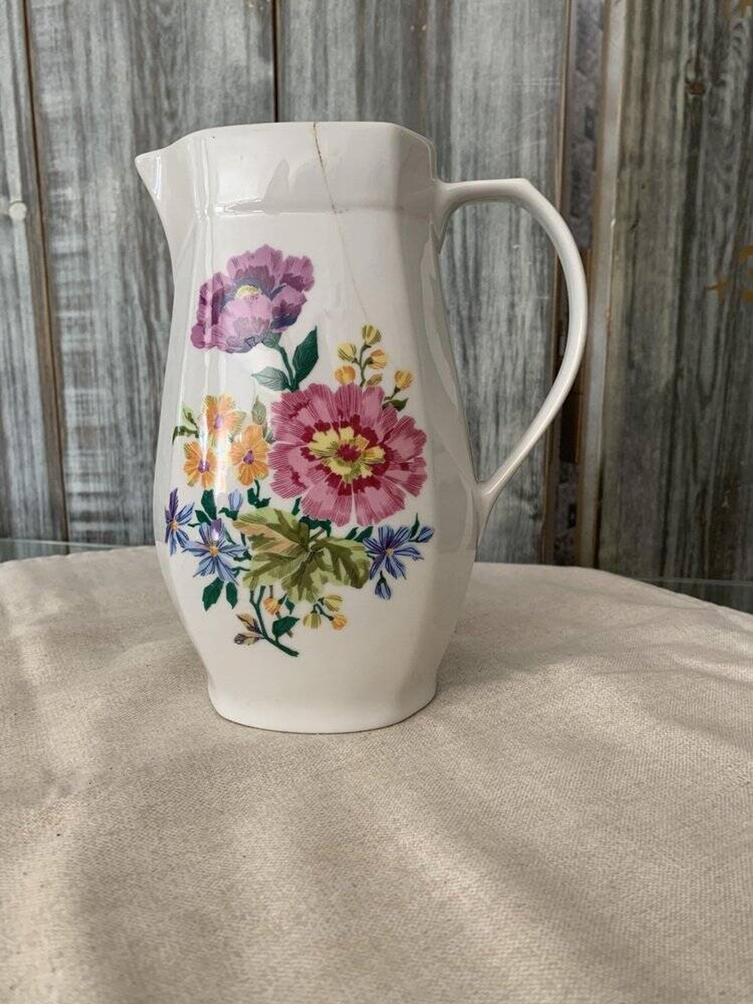 Vintage Alföldi pitcher in white porcelain with blue and red floral decoration, Folk Art.