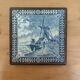 Ceramic tile trivet and wooden frame with Dutch windmill.