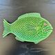 Fish dish in green earthenware