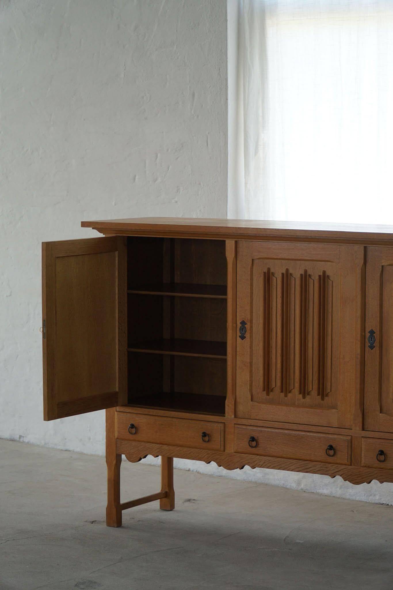 Brutalist oak sideboard, mid-century Danish design, Kjærnulf style, 1960s.