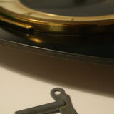 Famous black vintage mechanical wall clock