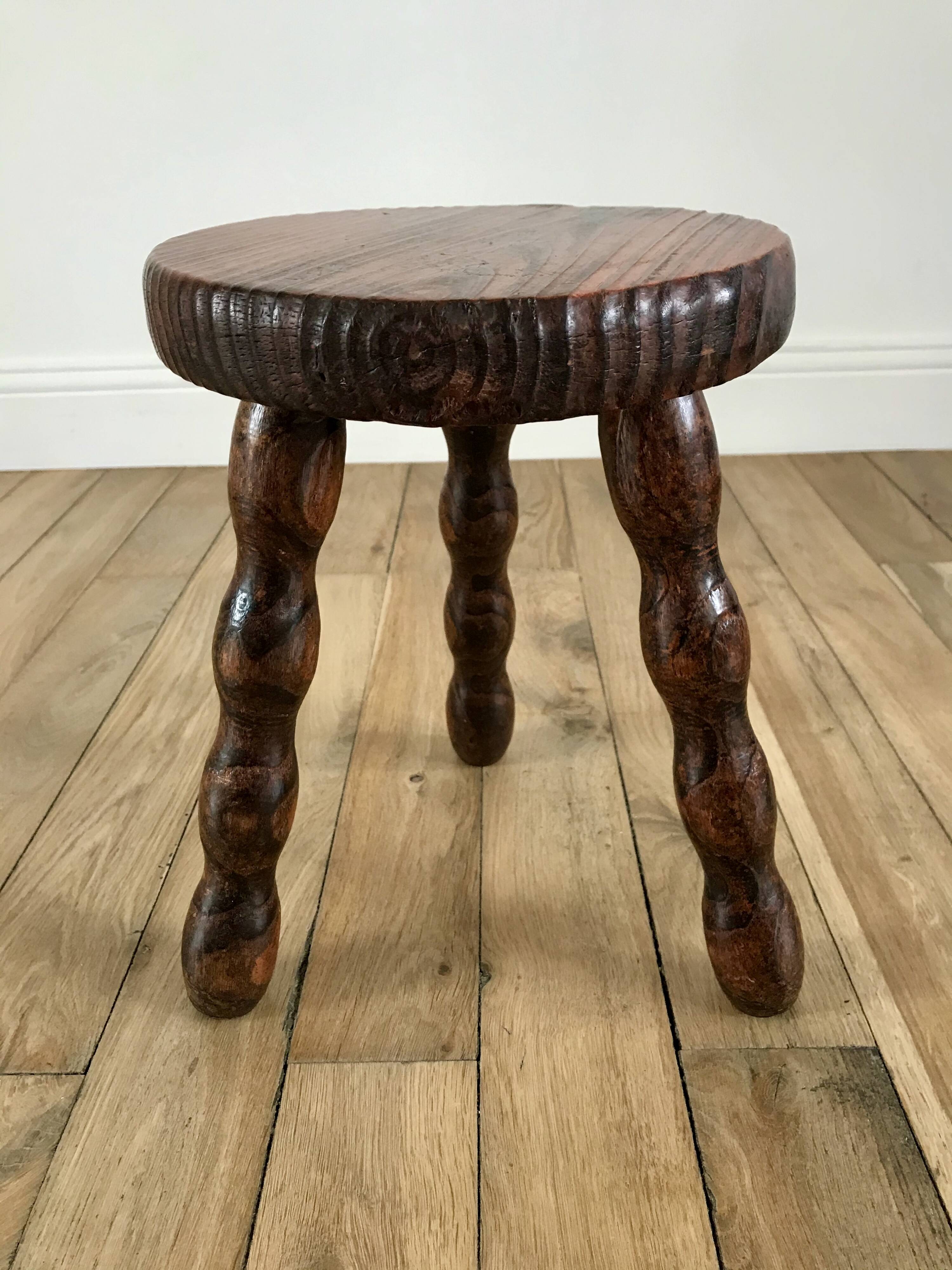 low stool in solid turned wood from the 70s