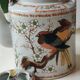 Japanese ceramic teapot. bird/paradise motifs/cherry trees. bamboo/rattan braided handle
