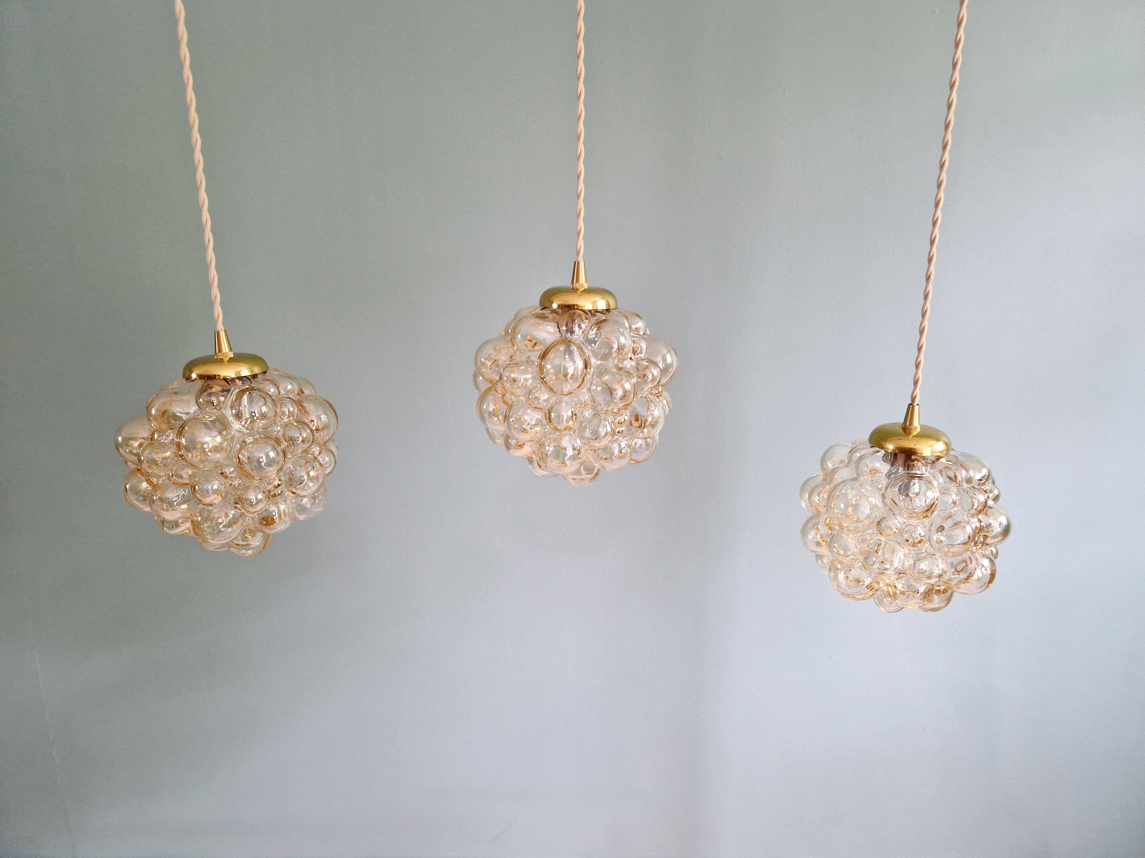 Amber bubble glass pendant (3 available), design by Helena Tynell, 1970.