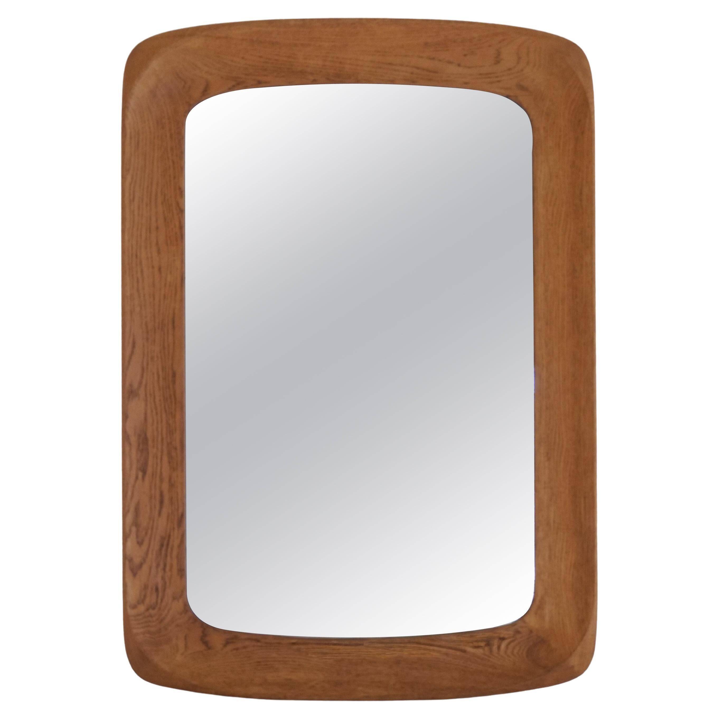 Mid-century modern sculptural wall mirror in stained oak, glass, Glas & Trä 1959