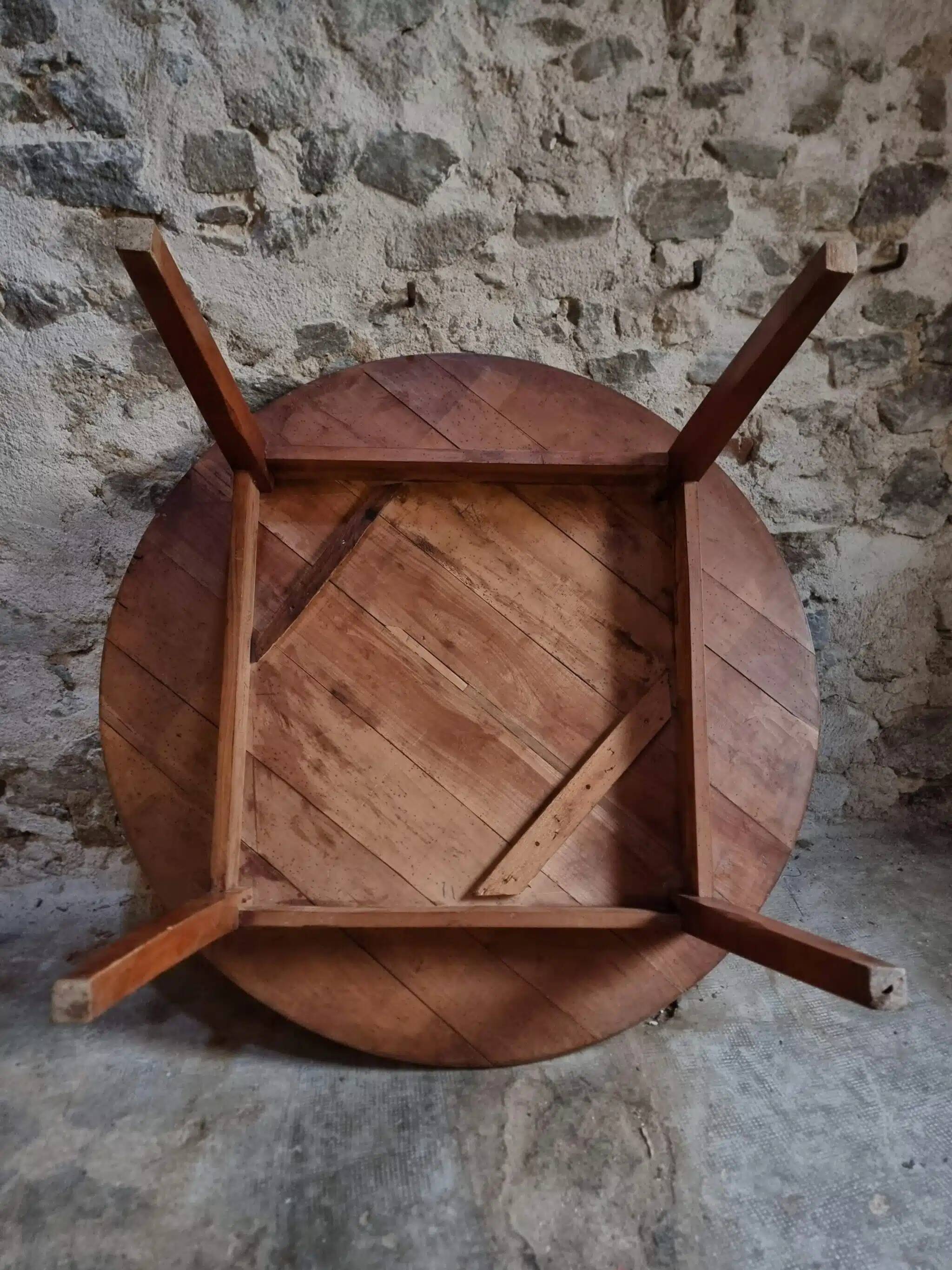 Antique round dining table in cherry wood, France, circa 1920.