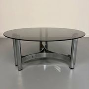 Round coffee table in smoked glass and chrome steel, 1970s design.