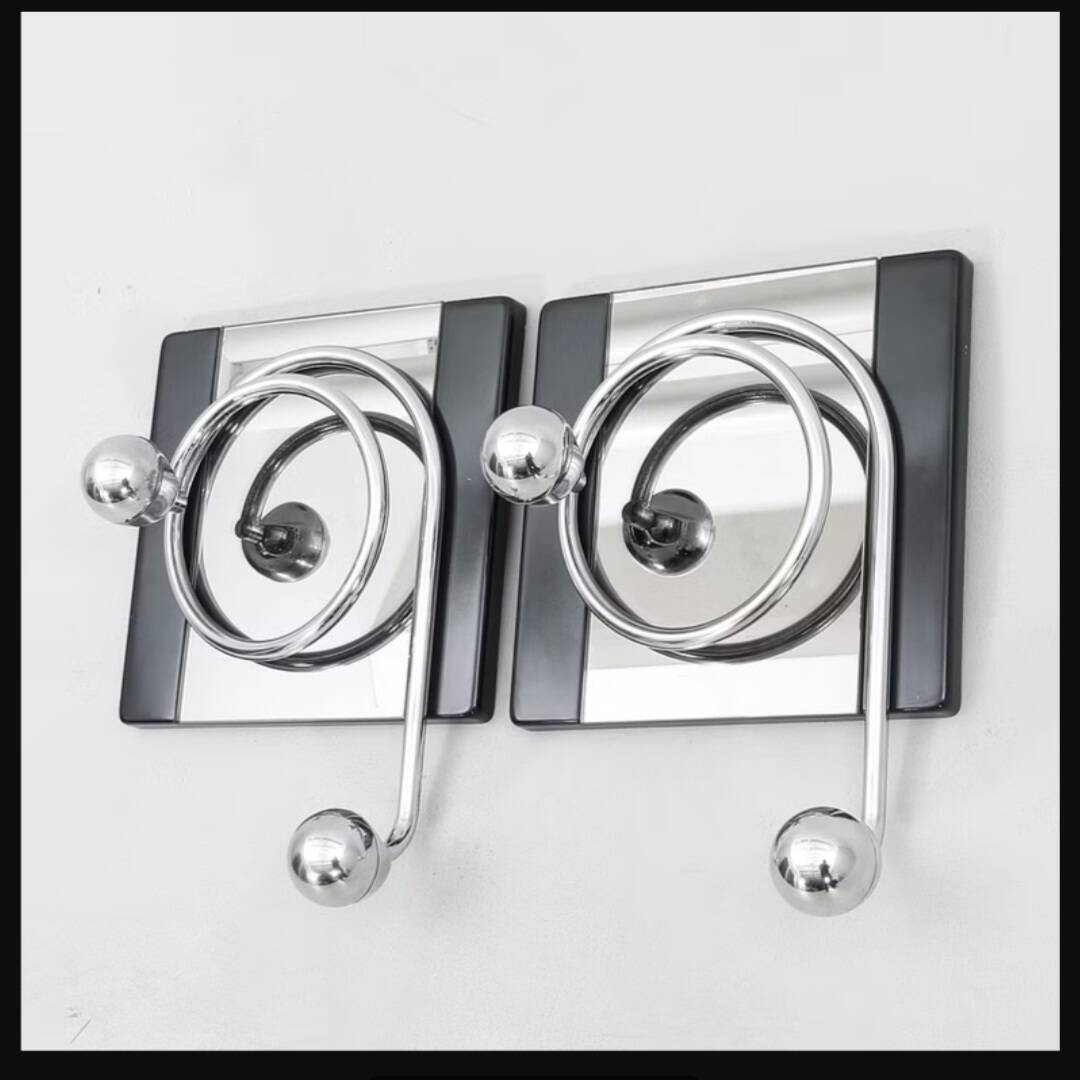 2 mirror hooks designed by Mario Sabot in Italy in the 1970s.