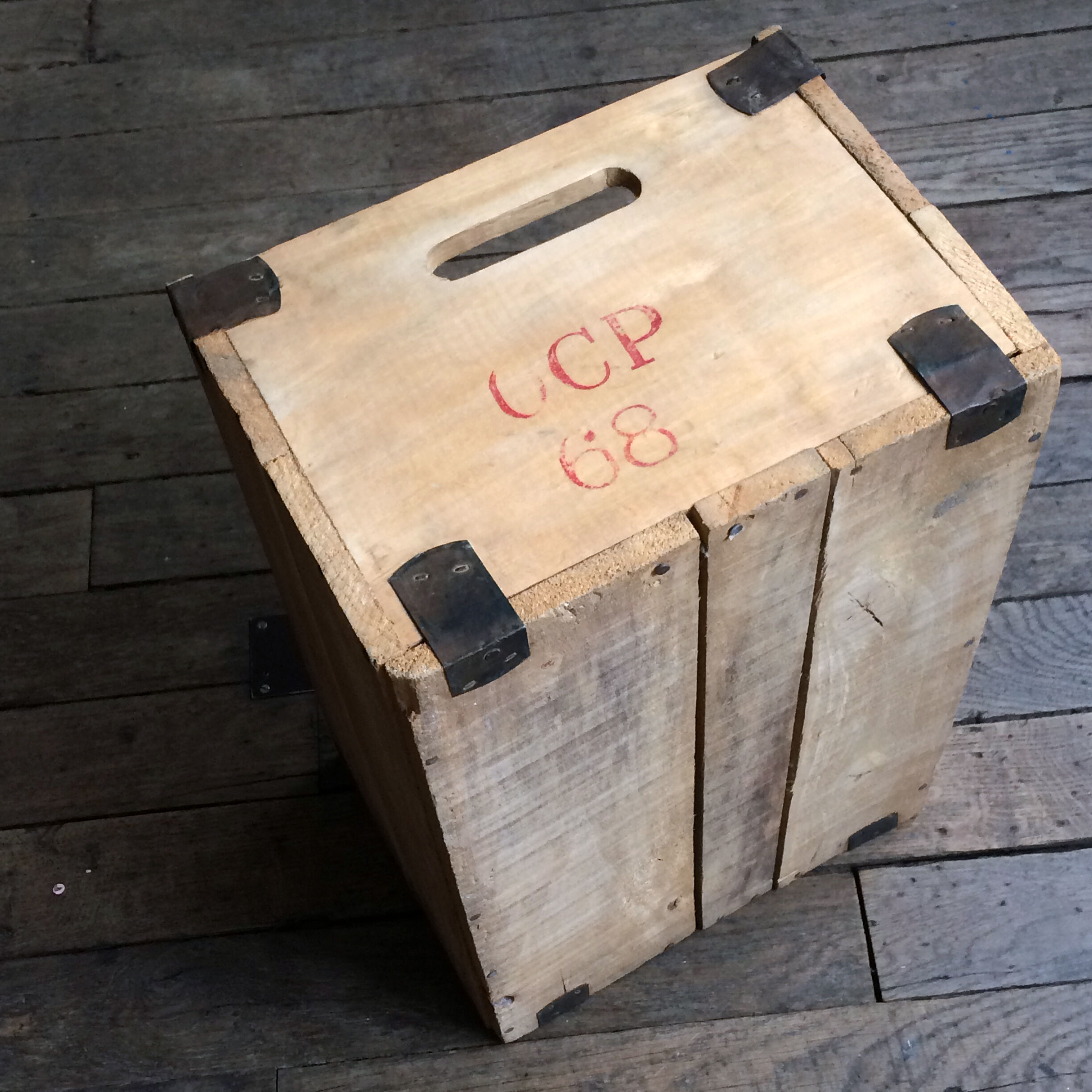 Wooden crate with metal fittings