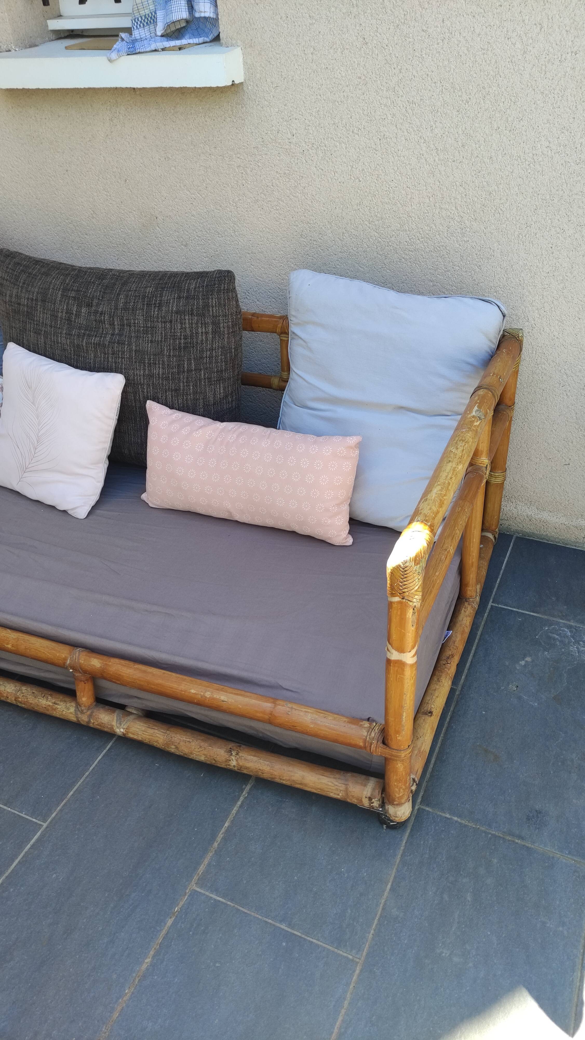Large vintage rattan sofa bed