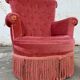 Fauteuil crapaud rose capitonné
