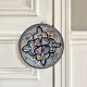 Polychrome decorative ceramic plate