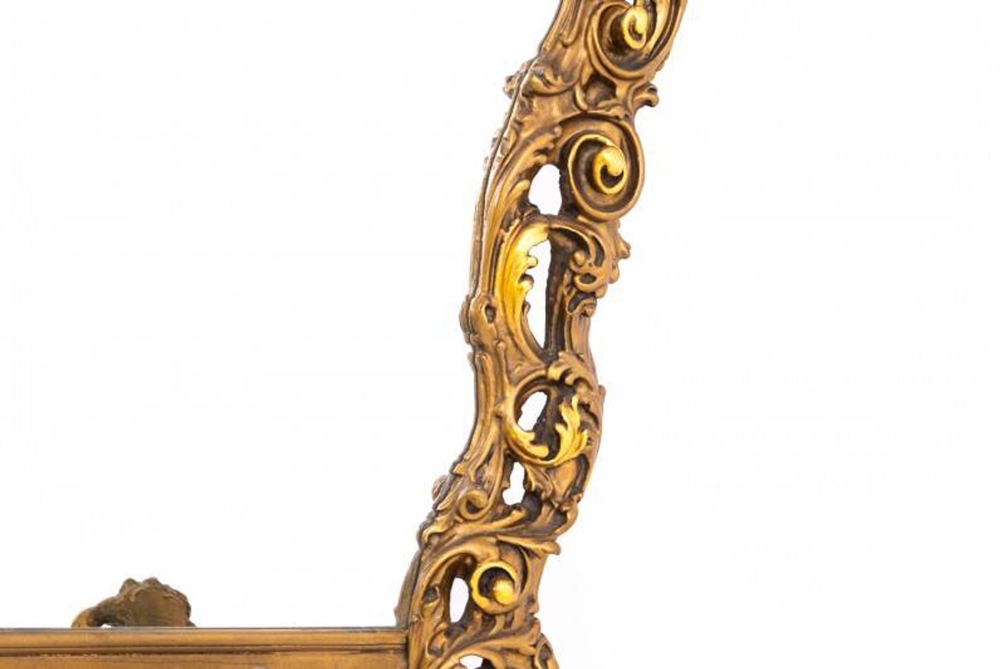 A large mirror in a gold frame, Italy, first half of the 20th century.