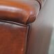 Fauteuil à oreilles de style anglais en cuir de vachette