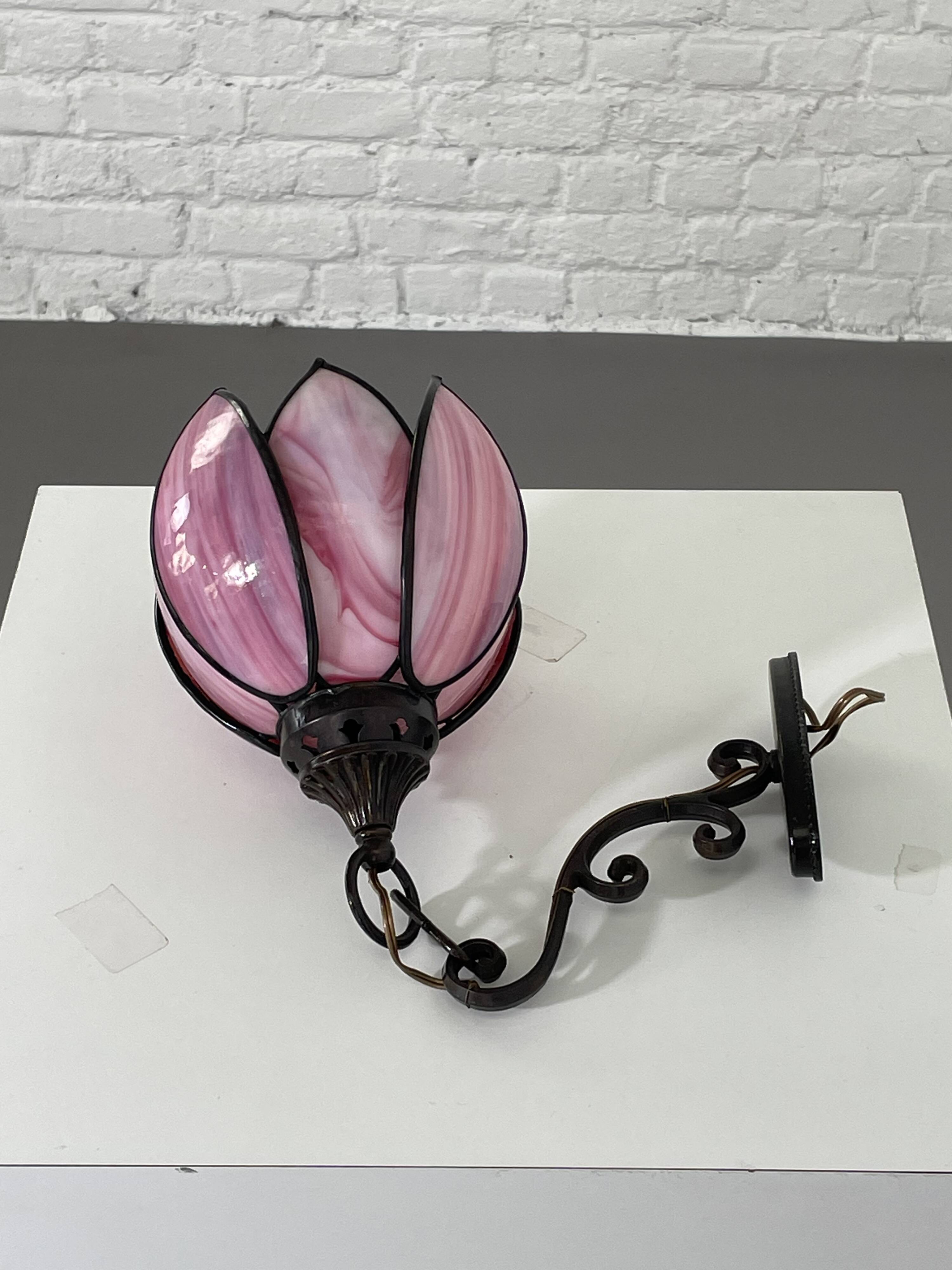 pair of iron wall lamps and Tiffany style glass legs