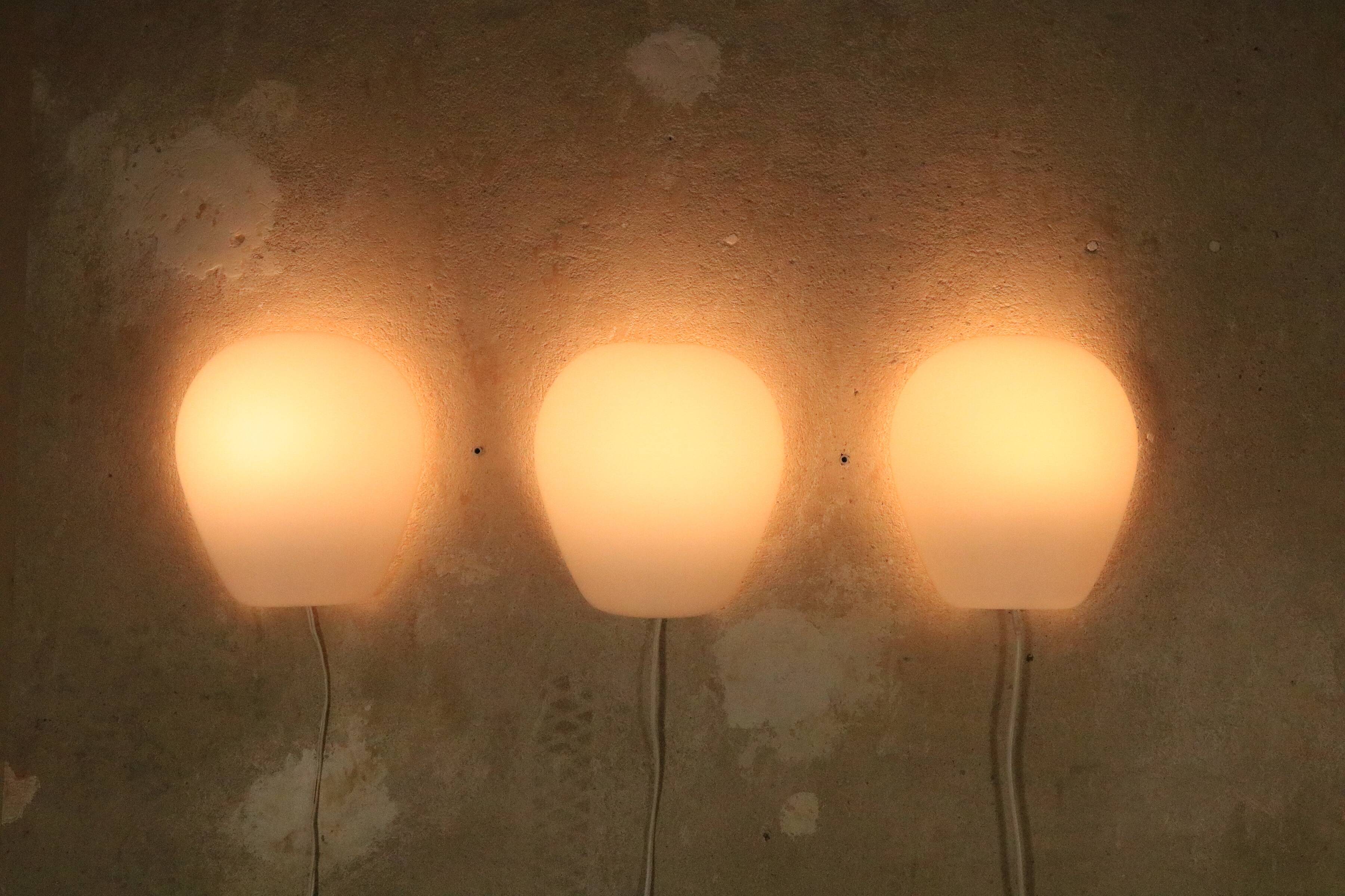3 Wilhem Wagenfeld wall lamps, Peill & Putzler, "Muschel", 1950s