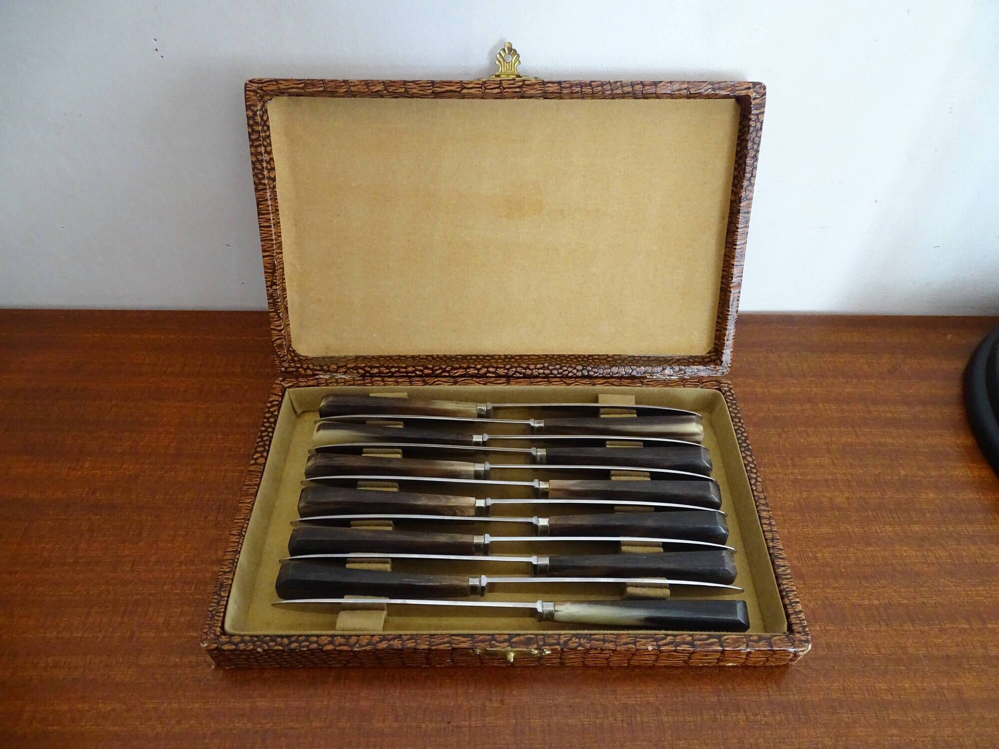 12 vintage Pradel cheese knives horn and stainless steel handles in case