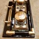 Hence the art deco inkwell on jet plate brass finishes