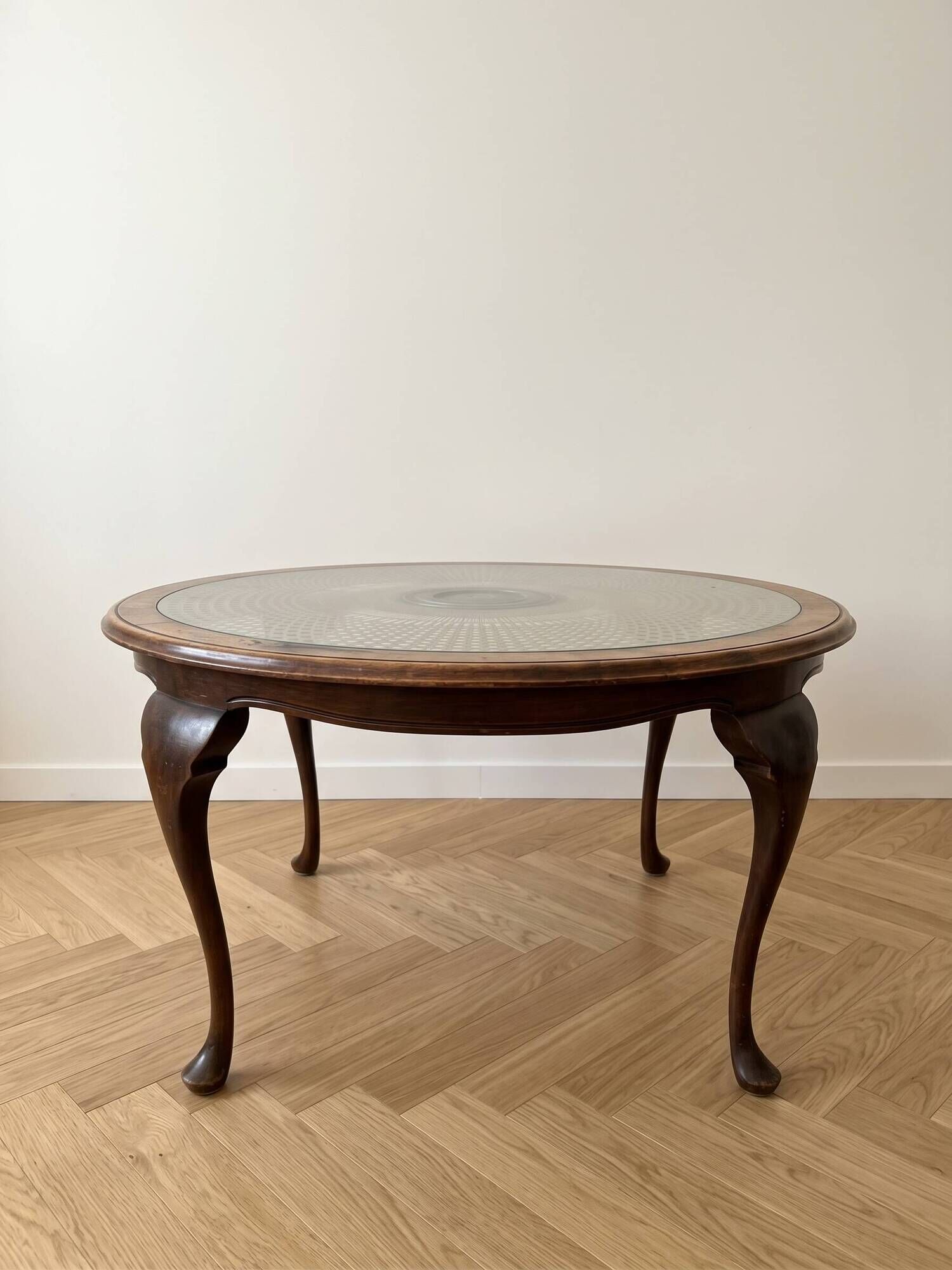 Louis XV coffee table in wood with decorative glass top.