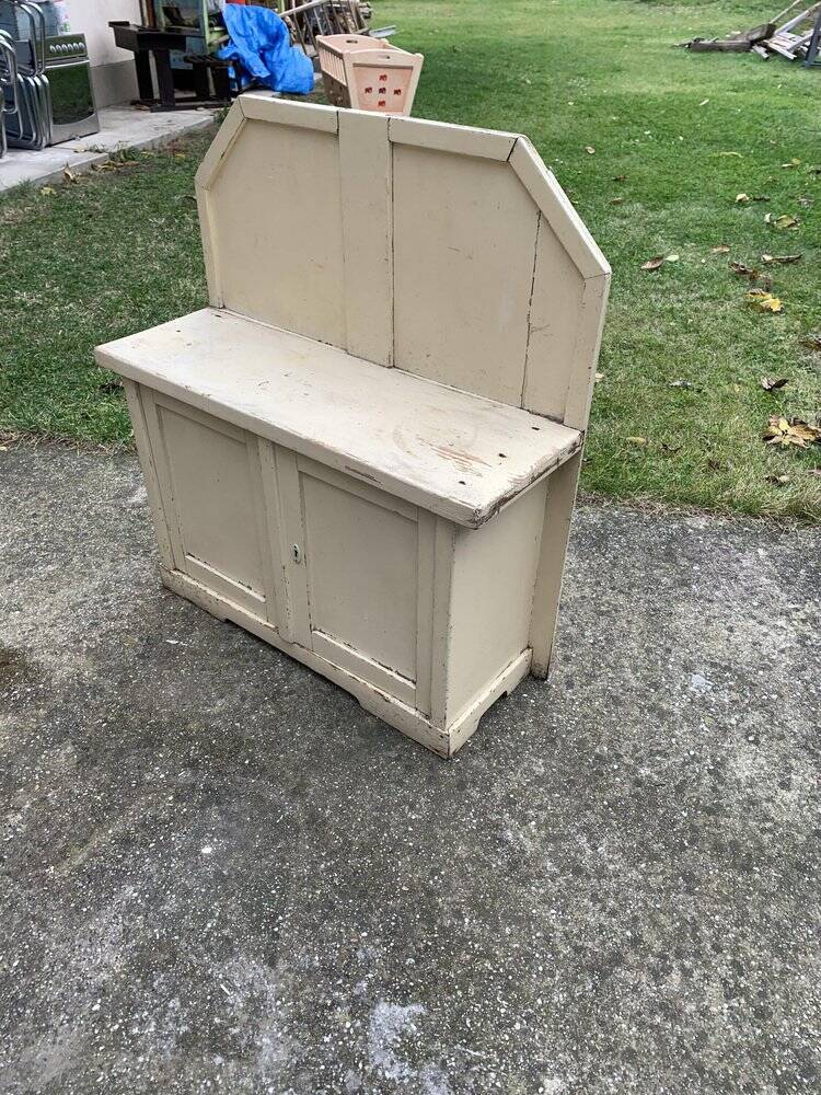 Small vintage yellow bench made of hand-painted wood, low storage from the 1920s.