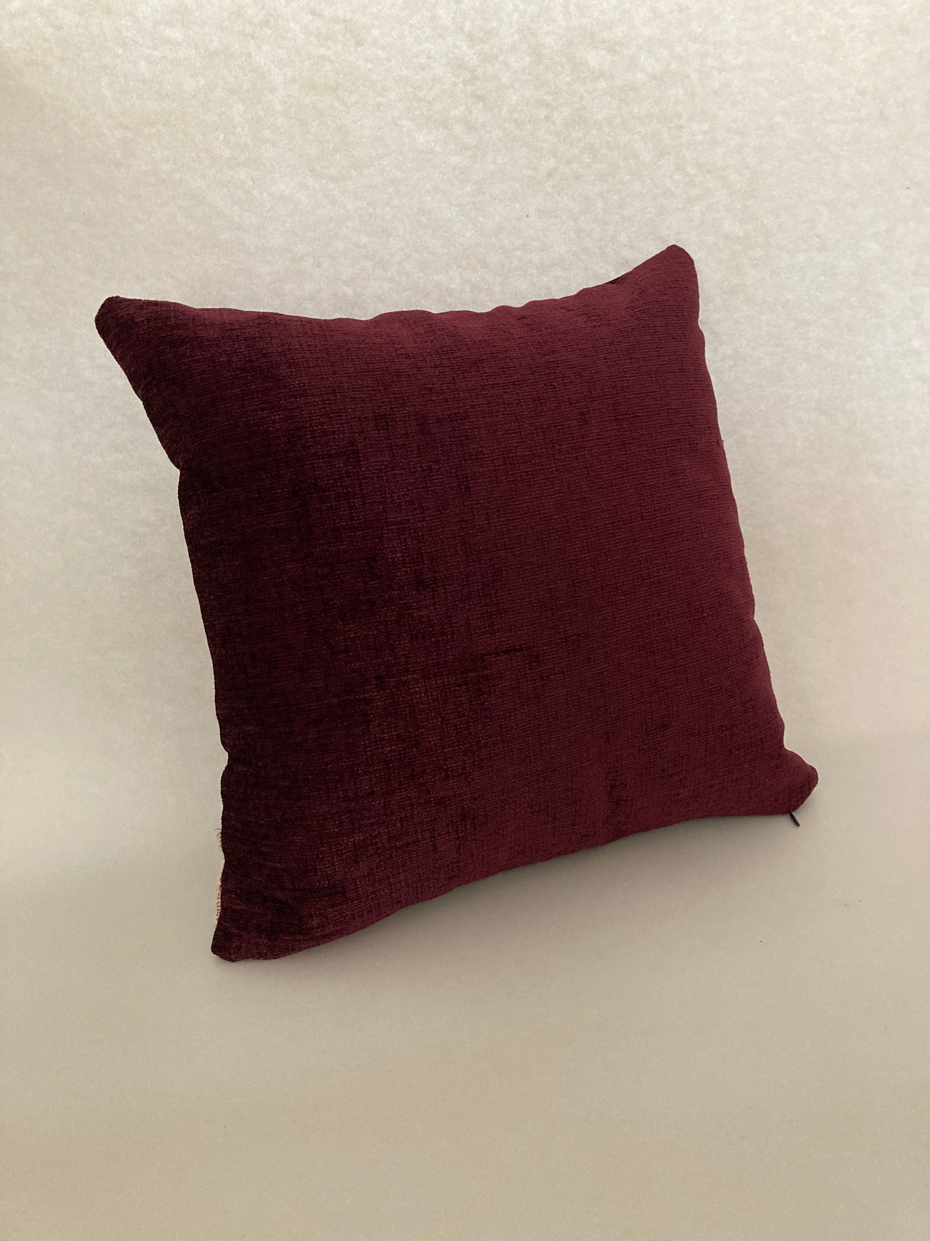 Plum purple velvet cushion