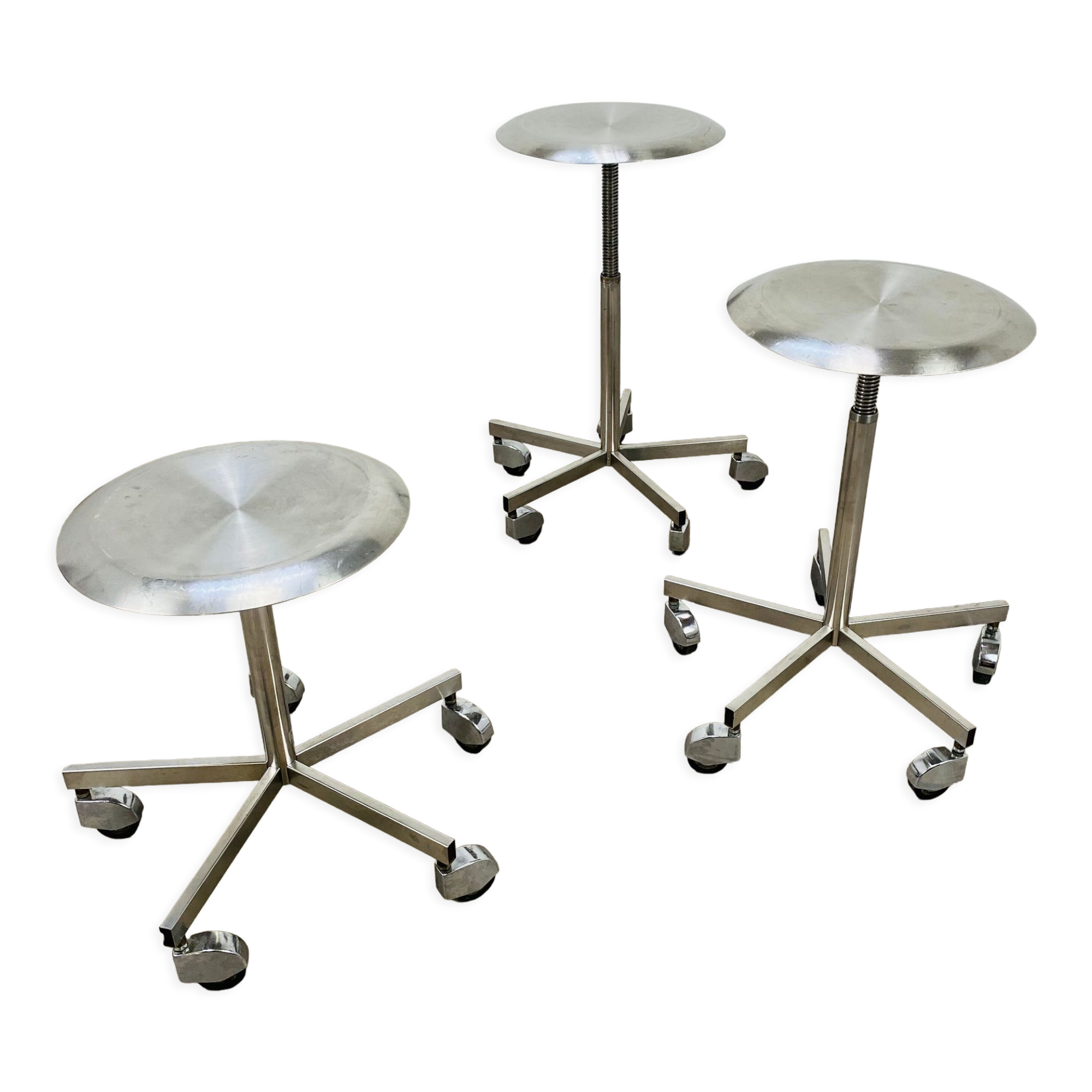 3 adjustable industrial stools with aluminum wheels