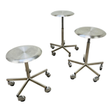 3 adjustable industrial stools with aluminum wheels