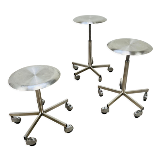 3 adjustable industrial stools with aluminum wheels