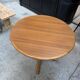 Modular round teak table with central base by Osvaldo Borsani.