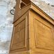 Wooden hardware cabinet painted with wood effect, circa 1940.