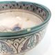 Cup on a ceramic pedestal – blue and turquoise geometric design.